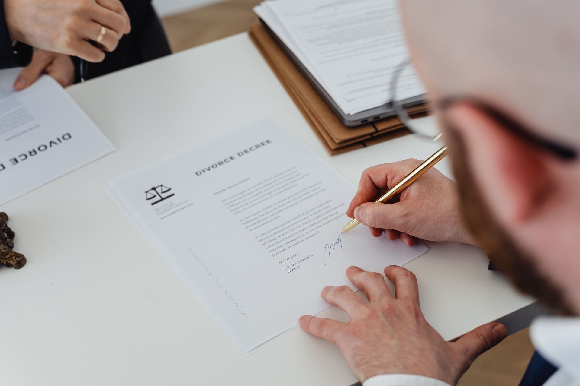 Business owner signing tender documents before the closing date