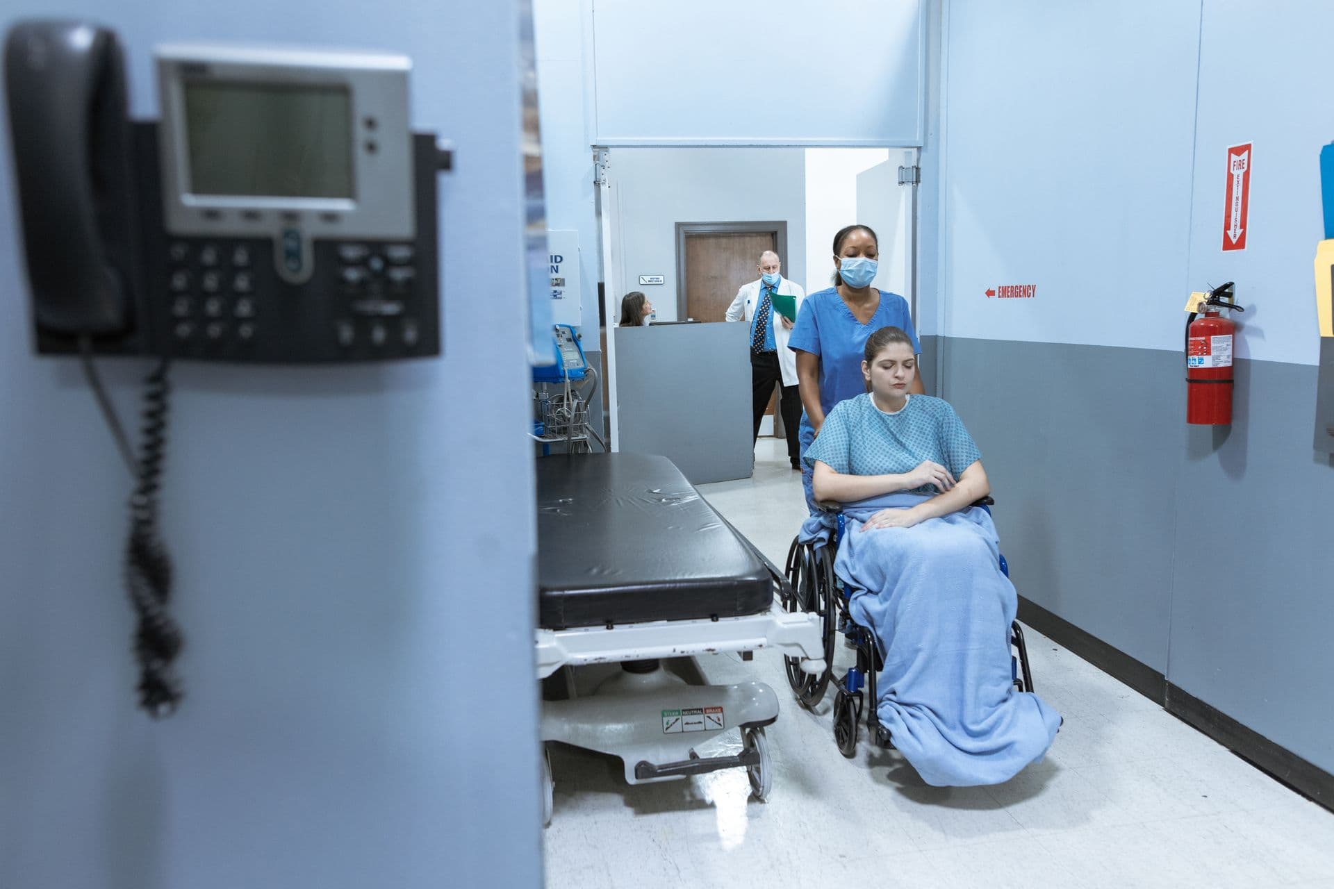 Medical professionals and hospital equipment, representing Department of Health tenders